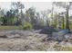 New home construction site showing concrete block foundation and a large pile of fill dirt at 362 Oliver Dr, New Smyrna Beach, FL 32168