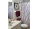 Bathroom featuring a single sink vanity, a standard toilet, and a shower with a patterned curtain at 806 South St, New Smyrna Beach, Fl 32168, FL 32168