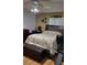 Comfortable bedroom with a decorative headboard, soft lighting, and charming wall decor at 806 South St, New Smyrna Beach, Fl 32168, FL 32168