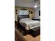 Comfortable bedroom with a decorative headboard, soft lighting, and charming wall decor at 806 South St, New Smyrna Beach, Fl 32168, FL 32168