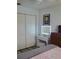 Comfortable bedroom featuring a vanity with a lighted mirror and built-in closet space at 806 South St, New Smyrna Beach, Fl 32168, FL 32168
