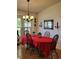 Bright dining room with a chandelier, shuttered windows, and dining table at 806 South St, New Smyrna Beach, Fl 32168, FL 32168