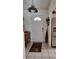 Inviting entryway featuring a tiled floor, decorative lighting, and a charming wooden accent table at 806 South St, New Smyrna Beach, Fl 32168, FL 32168