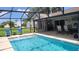 Inviting screened-in pool area with outdoor furniture, perfect for lounging and entertaining at 806 South St, New Smyrna Beach, Fl 32168, FL 32168