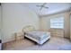 Bright bedroom with a ceiling fan, carpeted floors, and ample natural light at 4303 Sea Mist Dr # 225, New Smyrna Beach, FL 32169