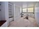 Bonus room featuring a built-in desk area, shelves, and a closet with louvered doors at 4303 Sea Mist Dr # 225, New Smyrna Beach, FL 32169