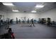 Bright exercise room with various weight machines, cardio equipment, ceiling fans, and a neutral color scheme at 4303 Sea Mist Dr # 225, New Smyrna Beach, FL 32169