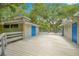 Community building with bright blue doors and a spacious deck perfect for relaxing or community gatherings at 4303 Sea Mist Dr # 225, New Smyrna Beach, FL 32169