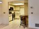 Cozy kitchen with stainless steel appliances, breakfast bar, and ample counter space for meal preparation at 4303 Sea Mist Dr # 225, New Smyrna Beach, FL 32169