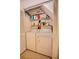 Laundry area with a side by side washer and dryer, along with storage shelves at 4303 Sea Mist Dr # 225, New Smyrna Beach, FL 32169