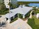 Aerial view of building with parking and a water view at 1 Riverwalk Dr # 202, New Smyrna Beach, FL 32169