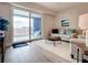 Cozy living room with sliding doors to a balcony and stylish furnishings at 1 Riverwalk Dr # 202, New Smyrna Beach, FL 32169