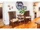 Bright dining area featuring hardwood floors, stylish decor, and plenty of natural light at 4606 Doris Dr, New Smyrna Beach, FL 32169