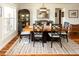 Inviting dining room featuring a wooden table, stylish chairs, hardwood floors, and natural light at 4606 Doris Dr, New Smyrna Beach, FL 32169