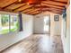 Inviting room with bamboo ceiling, featuring a window and a door to the outdoor space at 4606 Doris Dr, New Smyrna Beach, FL 32169