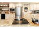 Modern kitchen with stainless steel appliances, ample counter space, and custom Cocktail Cove nook at 4606 Doris Dr, New Smyrna Beach, FL 32169