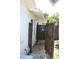 Private outdoor shower with wood enclosure, offering a refreshing experience amidst tropical plants at 4606 Doris Dr, New Smyrna Beach, FL 32169