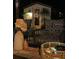Cozy patio seating area, perfect for relaxing outdoors at night in a tranquil setting at 4606 Doris Dr, New Smyrna Beach, FL 32169