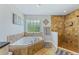 Bathroom with a walk-in shower and a corner bathtub at 756 Bay Dr, New Smyrna Beach, FL 32168