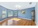 Sunlit dining room with hardwood floors and bay windows at 756 Bay Dr, New Smyrna Beach, FL 32168