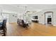 Open living room with hardwood floors and views to kitchen and dining areas at 756 Bay Dr, New Smyrna Beach, FL 32168