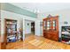 Spacious home office with hardwood floors and built-in shelving at 756 Bay Dr, New Smyrna Beach, FL 32168