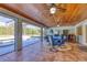 Covered patio overlooking the pool, perfect for outdoor dining and entertaining at 756 Bay Dr, New Smyrna Beach, FL 32168