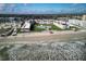 Aerial view of a beachfront condo complex with a pool and lounge area and easy beach access, plus an ocean view at 3663 S Atlantic Ave # 21C, New Smyrna Beach, FL 32169