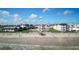 Beachfront condo complex with easy beach access and a pool and lounge area in a lushly landscaped space between buildings at 3663 S Atlantic Ave # 21C, New Smyrna Beach, FL 32169