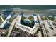 Aerial view of a beachfront condo complex with lush landscaping, pool, and private beach access at 3663 S Atlantic Ave # 21C, New Smyrna Beach, FL 32169