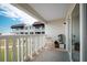 Private balcony featuring lovely exterior views, outdoor furniture, and quaint potted plants, great for relaxing at 3663 S Atlantic Ave # 21C, New Smyrna Beach, FL 32169
