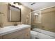 Bathroom featuring a shower-tub combo with a white vanity at 3663 S Atlantic Ave # 21C, New Smyrna Beach, FL 32169
