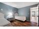 Bedroom featuring two beds and a view into the hallway at 3663 S Atlantic Ave # 21C, New Smyrna Beach, FL 32169