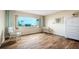 Cozy bedroom with waterfront views and white wicker furniture, allowing for relaxed living at 3663 S Atlantic Ave # 21C, New Smyrna Beach, FL 32169