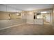 Spacious living room with tile flooring and mirrored wall accents at 3663 S Atlantic Ave # 21C, New Smyrna Beach, FL 32169