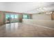 Spacious living room with tile flooring, chandelier and ocean views at 3663 S Atlantic Ave # 21C, New Smyrna Beach, FL 32169