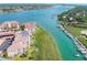 Aerial view of waterfront condo building near bridge and waterway at 434 Bouchelle Dr # 304, New Smyrna Beach, FL 32169
