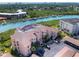 Aerial view of waterfront condo building with parking and boat slips at 434 Bouchelle Dr # 304, New Smyrna Beach, FL 32169