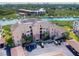 Aerial view of waterfront condo building with parking and boat slips at 434 Bouchelle Dr # 304, New Smyrna Beach, FL 32169