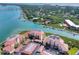 Aerial view of waterfront condo community near bridge and waterway at 434 Bouchelle Dr # 304, New Smyrna Beach, FL 32169