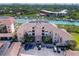 Aerial view of waterfront condo building with parking and boat slips at 434 Bouchelle Dr # 304, New Smyrna Beach, FL 32169