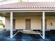 Close-up of assigned carport parking area with adjacent storage closets at 434 Bouchelle Dr # 304, New Smyrna Beach, FL 32169