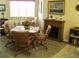 Cozy dining area with wood table, four chairs, and an electric fireplace at 434 Bouchelle Dr # 304, New Smyrna Beach, FL 32169