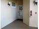 Exterior of the front door with unit number, adjacent to a wall mounted fire extinguisher at 434 Bouchelle Dr # 304, New Smyrna Beach, FL 32169