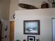 Interior view showcasing the decor above the doorway with wall art at 434 Bouchelle Dr # 304, New Smyrna Beach, FL 32169