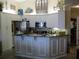 Bright kitchen with white cabinetry, granite countertops, and stainless steel appliances at 434 Bouchelle Dr # 304, New Smyrna Beach, FL 32169