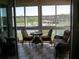 Screened lanai with comfortable seating and waterfront views at 434 Bouchelle Dr # 304, New Smyrna Beach, FL 32169