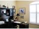 Nice office featuring a large desk, built-in shelving and natural light at 434 Bouchelle Dr # 304, New Smyrna Beach, FL 32169