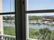 Scenic water view featuring boats, marina, and lush greenery at 434 Bouchelle Dr # 304, New Smyrna Beach, FL 32169