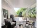 Relaxing covered patio with comfortable seating, ideal for enjoying the outdoors at 1312 2Nd St, Edgewater, FL 32132
